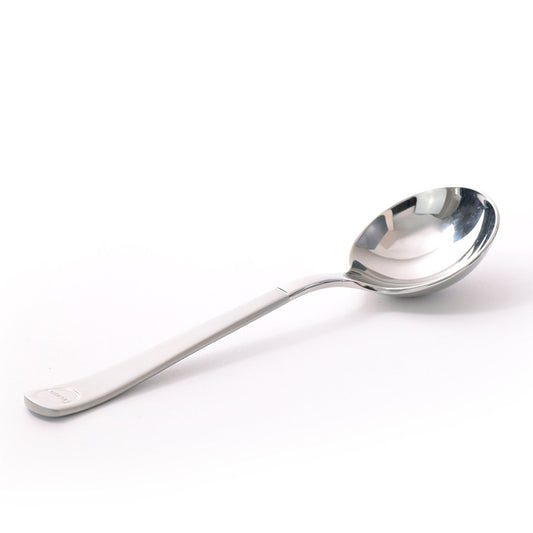 En skinnende Brewista, Professional Cupping Spoon (Titanium - Stål) med et moderne, ergonomisk håndtag hviler på en almindelig hvid overflade. Skeens afrundede skål er let reflekterende og viser højlys og skygger fra belysningen, der minder om et værktøj brugt af baristaer.